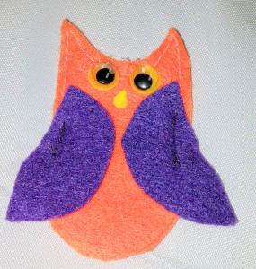Felt owl with google eyes is a finger puppet who-o-o has a secret pocket in the felt tree.