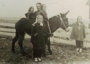That is me, young No Non-cents Nanna holding the Francis our burro's nose.